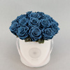 Blue preserved roses in a black box